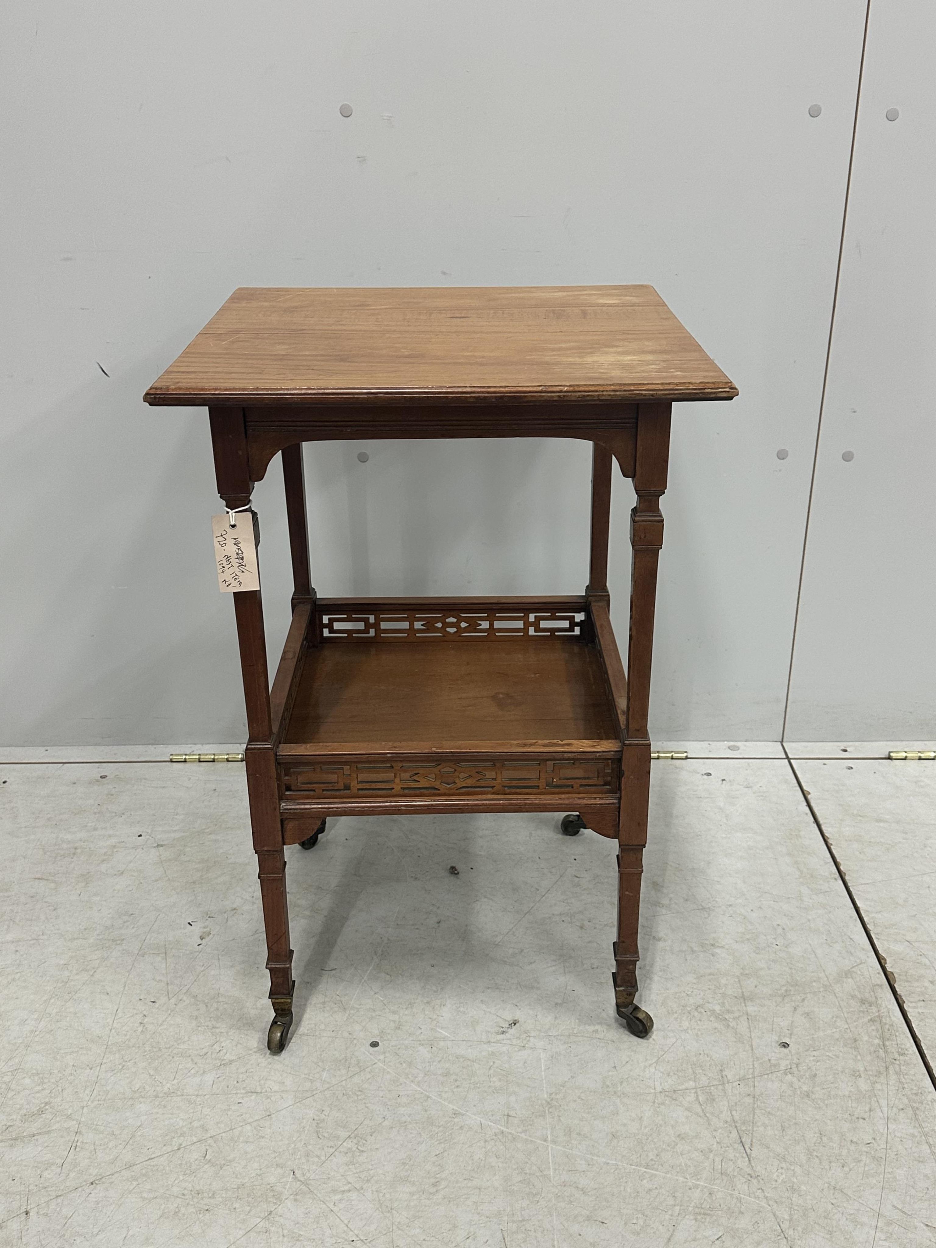 A late Victorian Aesthetic Movement satinwood two tier occasional table, width 48cm, depth 47cm, height 73cm. Condition - fair